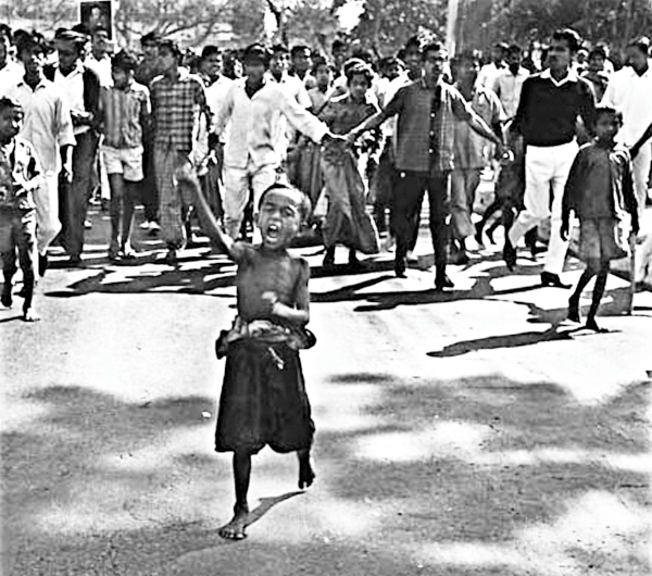 A kid is leading a procession during 1969 agitation.