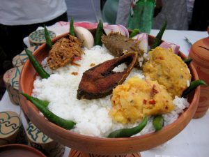Panta Ilish – a traditional platter of Panta bhat, with fried ilish slice, supplemented with dried fish (shutki), pickles (achar), dal, chillies, and onion – is a popular dish during the Pohela Boishakh festival.