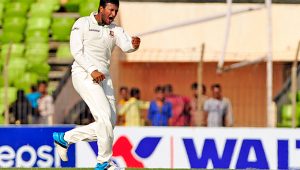 Shakib Al Hasan pumps his fist in the air after becoming the third Test cricketer -- after Ian Botham and Imran Khan -- to achieve the milestone.